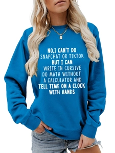 Close-up of ribbed cuffs and white letter print on a blue cotton blend sweatshirt