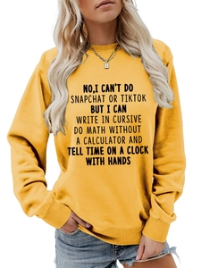 Close-up of black humorous slogan print on yellow cotton crewneck sweatshirt
