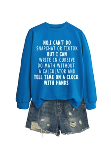 Flat lay of royal blue sweatshirt and distressed denim shorts with white graphic text