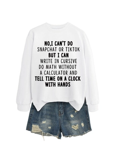 Detail of white crewneck sweatshirt with slogan print and distressed denim shorts set