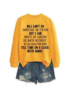 Flat lay of yellow crewneck sweatshirt with text print and distressed denim shorts