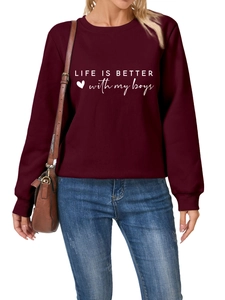 Detail of burgundy sweatshirt showing Life is better with my boys print and cotton texture