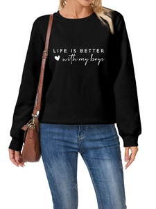 Detail of 'Life is better with my boys' slogan print on thick black sweatshirt fabric