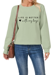 Close-up of sage green sweatshirt with Life Is Better With My Boys text and ribbed cuffs