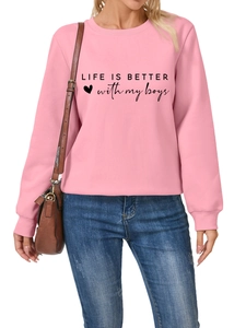 Close-up of Life Is Better With My Boys text and heart print on pink crewneck sweatshirt