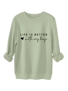 Detail of sage green crewneck sweatshirt with 'Life is better with my boys' print