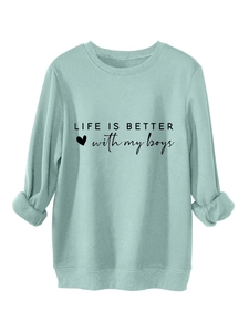 Close-up of Life Is Better With My Boys text and ribbed cuffs on light blue sweatshirt