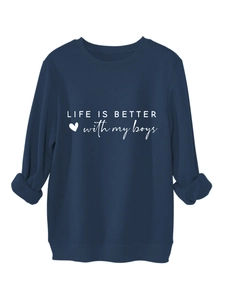 Close-up of navy blue sweatshirt showing ribbed cuffs and Life is better printed text