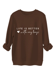 Detail of ribbed crew neck and white slogan print on brown thick cotton sweatshirt