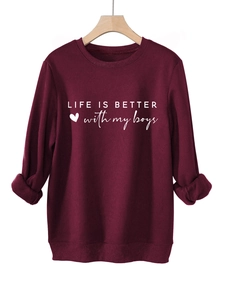 Detail of the Life Is Better With My Boys slogan and heart print on a burgundy sweatshirt