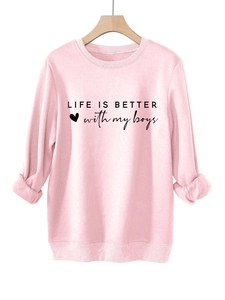 Detailed view of pink crewneck sweatshirt featuring Life is Better with My Boys print