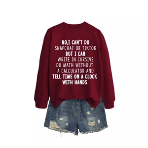 Burgundy crewneck sweatshirt with white letter print and distressed denim shorts