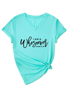 Detail of mint green V-neck T-shirt showing rolled sleeves and knot-tie hem finish