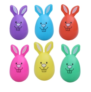 Close-up of six colorful Easter bunny egg ornaments with cute faces and 3D ears