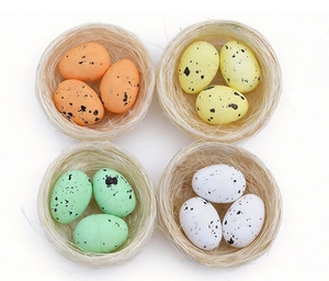 Detail view of colorful Easter eggs in four woven nests for festive shop decoration