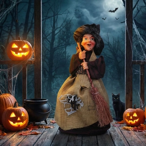 Hanging Halloween witch with broomstick and burlap dress in a spooky night forest scene