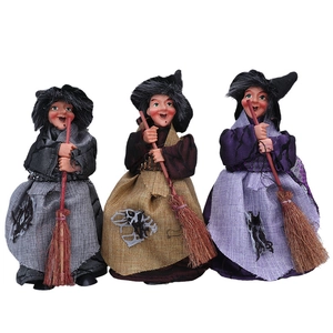 Three Halloween witch figurines with brooms in grey, brown, and purple festive colors