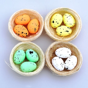 Easter decoration set featuring four natural straw bird nests with 12 speckled colorful eggs