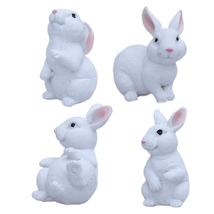 Set of four cute white resin Easter bunny figurines in various poses for home garden decor