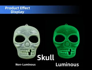 Glow in the dark Halloween skull pendant showing day and night fluorescence effect