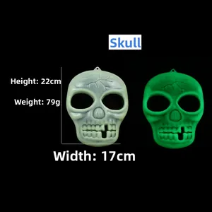 Luminous Halloween skull mask 22cm high showing green glow effect in the dark
