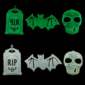 Luminous Halloween decorations set including RIP tombstone, bat and skull in green glow