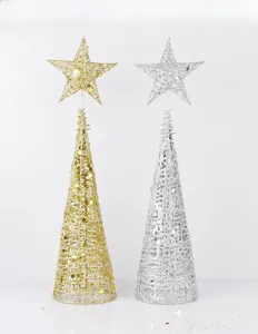 Detail of gold and silver cone Christmas trees with glitter sequins and star topper