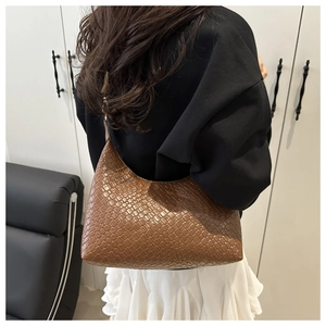 Detailed view of brown woven PU leather hobo bag showing texture and large capacity