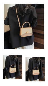 Detail of beige flap bag featuring gold buckle and textured leather on a model