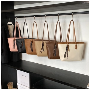 Selection of minimalist lychee pattern bucket bags in six colors on display