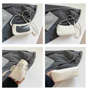 Detail view of white underarm bag with star accents and transparent window from four angles