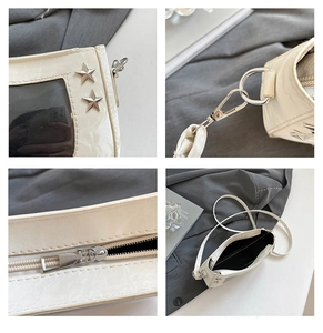 Close-up of beige Y2K itabag showing star rivets, zipper, and clear window detail