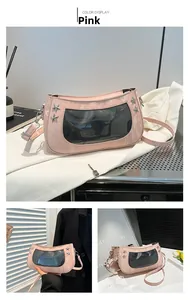 Detailed view of pink ita bag with star studs and transparent display window