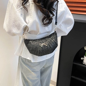 Women's trendy black woven crescent bag with golden butterfly accent and leather strap