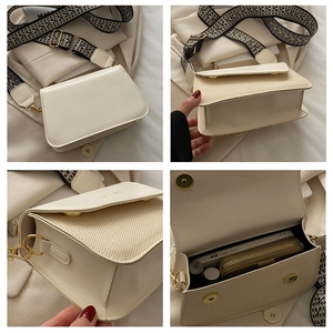 Detail view of cream square crossbody bag with woven texture and patterned strap