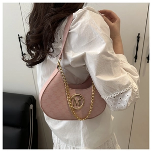 Detail of pink half-moon bag featuring gold metal circle with M logo and chain strap