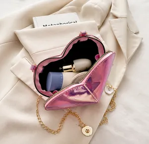 Macro shot of the mini pink heart-shaped bag interior showing space for makeup