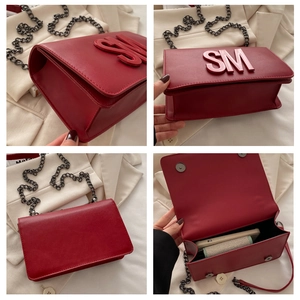 Detailed views of red leather crossbody bag featuring 3D metal letters and chain strap