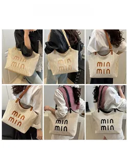 Detail showing various colors of woven tote bags with large capacity for beach vacations