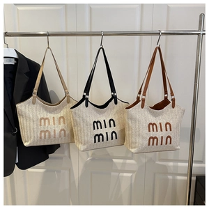 Detailed set of woven tote bags in beige, brown and black with min min embroidery