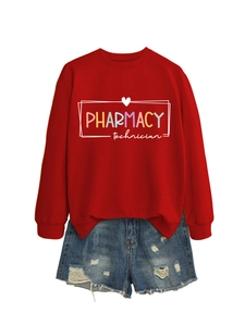 Detailed view of red crewneck sweatshirt with pharmacy print and distressed denim shorts