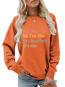 Detail view of ribbed crew neck and high-quality artistic typography on orange sweatshirt