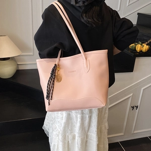 Pink large capacity faux leather tote bag with fashion print and tassel charm detail