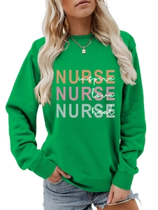 Close-up of green crewneck sweatshirt with Nurse inspire love heal colorful print design