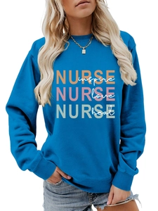 Detail of blue nurse sweatshirt showing inspire love heal print and soft knit texture