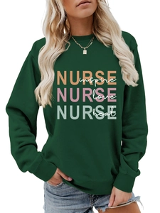Detail of dark green sweatshirt with Nurse Inspire Love Heal graphic print on chest