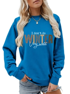 Detail view of the ribbed cuffs and artistic lettering on the blue crewneck sweatshirt