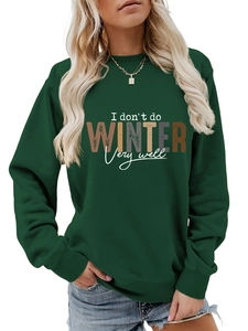 Detail of the vintage slogan print and ribbed cuffs on this dark green crewneck sweatshirt