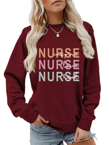 Close-up of the ribbed crewneck and nurse theme print on burgundy cotton sweatshirt