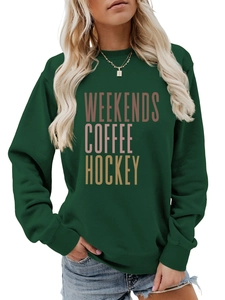 Detail of dark green sweatshirt featuring weekends coffee hockey vintage text print
